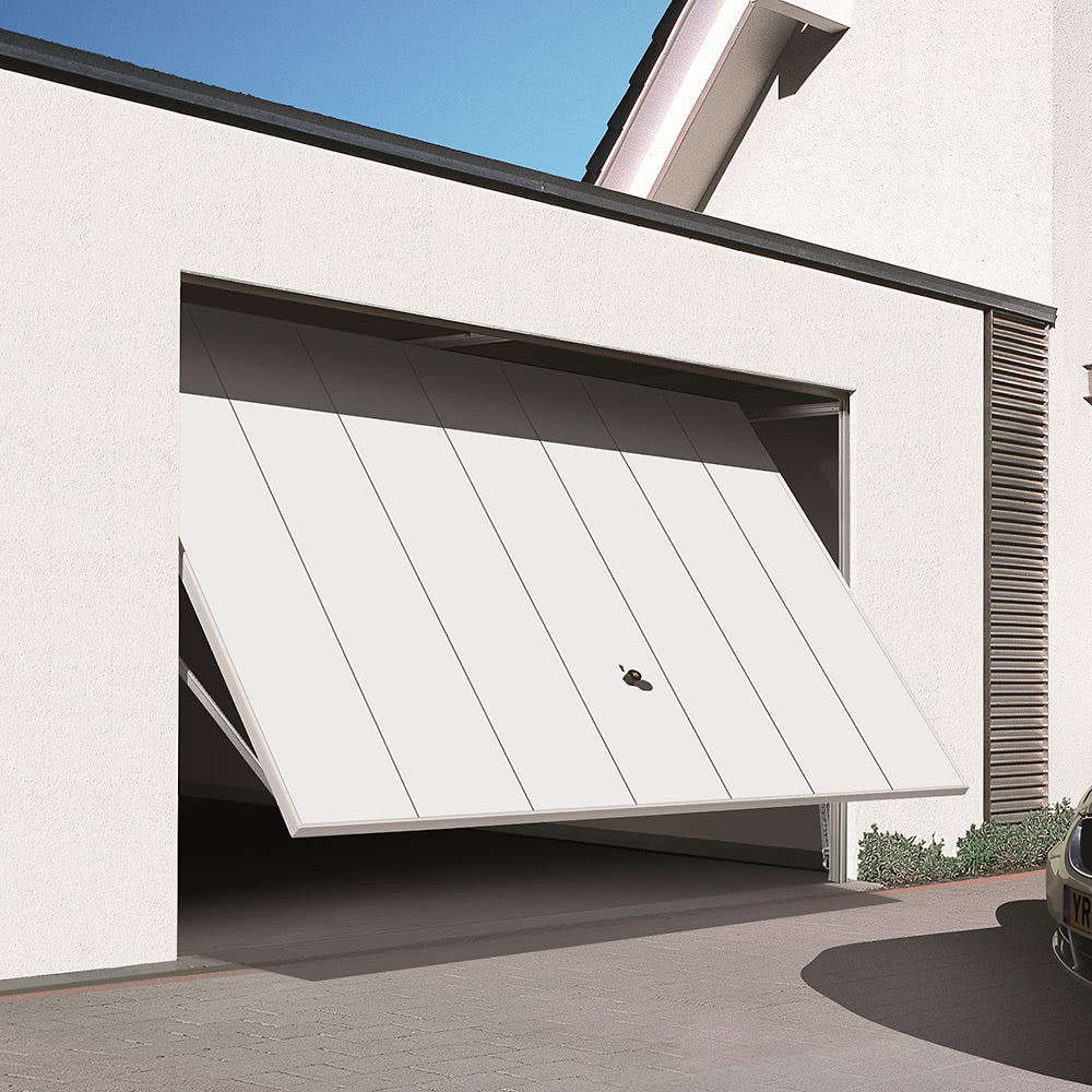 White double garage doors fitted to a home in Bolton